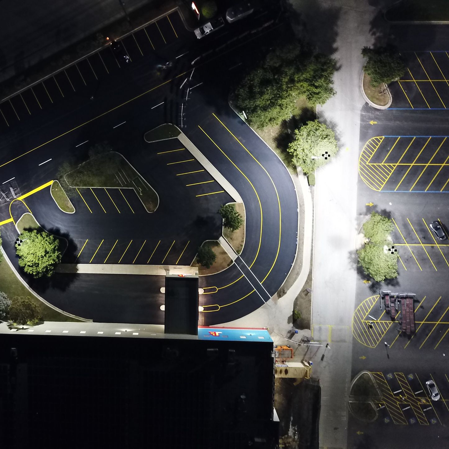 Aerial view of a freshly striped commercial parking lot and drive aisles in San Antonio