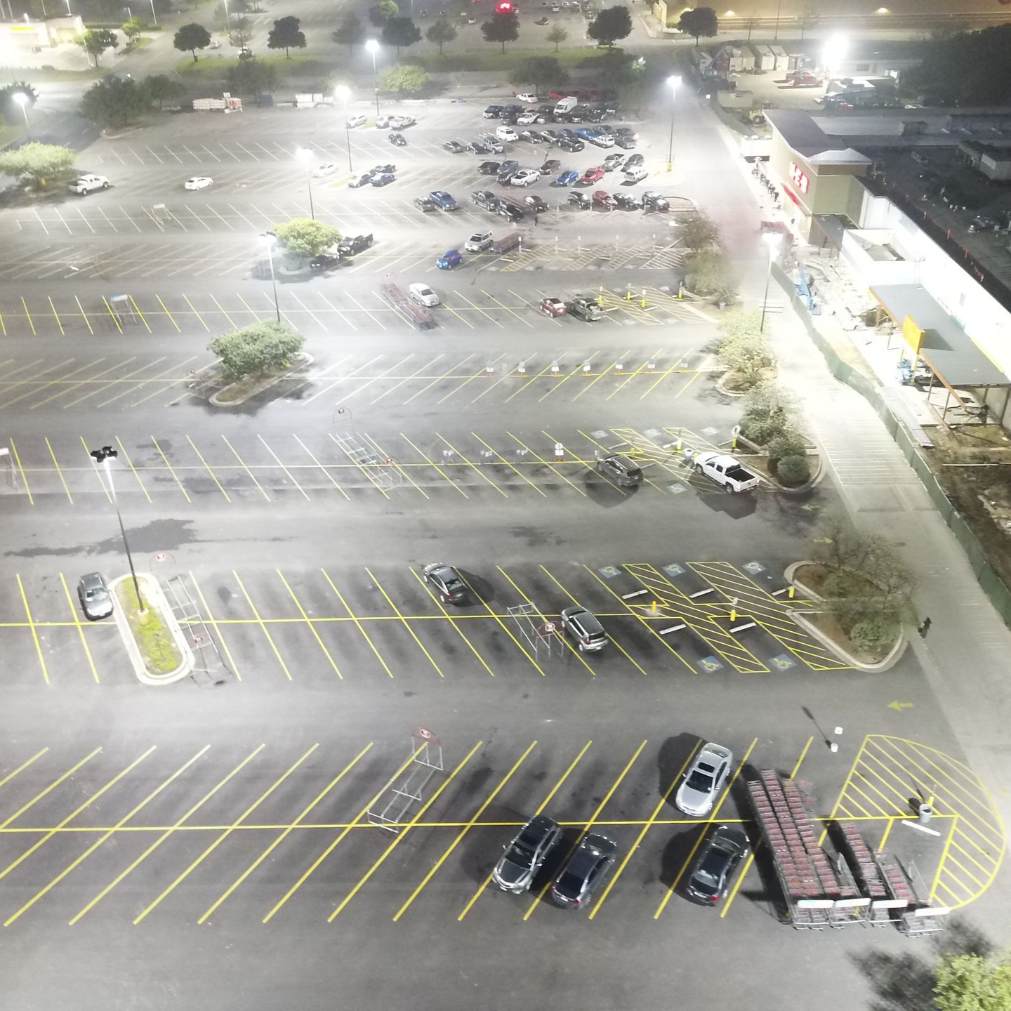 Retail parking lot striped at night by Pro-Line Paving crews in San Antonio