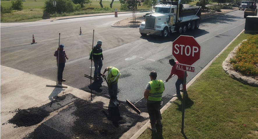 Compacted asphalt surface on a completed commercial paving project in Texas