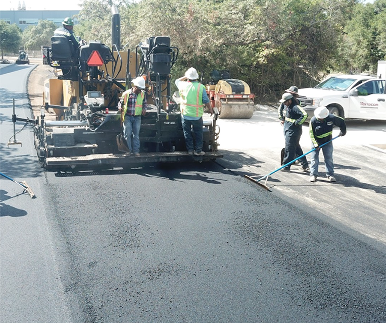 Pro-Line Paving crew placing hot mix asphalt on a San Antonio street