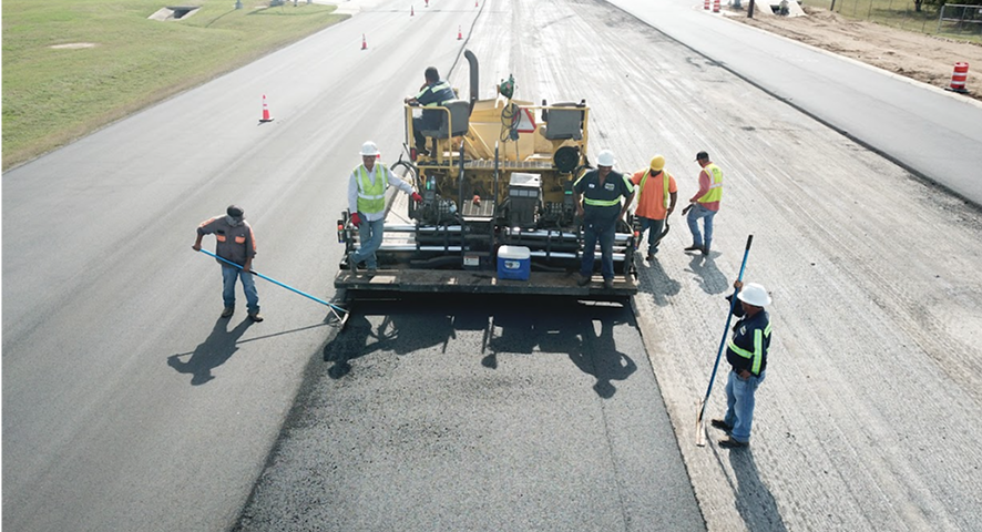 Close view of a milled asphalt surface showing removed top layer