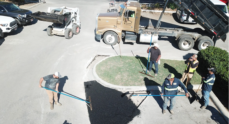 Pro-Line Paving crew laying an asphalt overlay in San Antonio