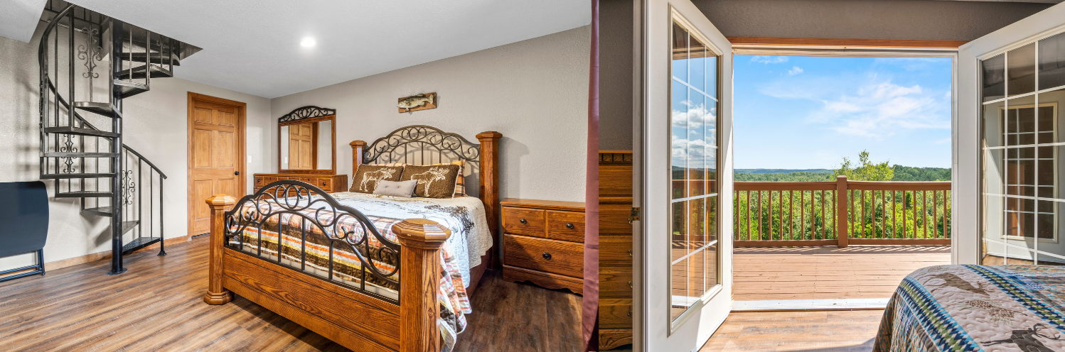 Bright bedroom with wooden bed and spiral staircase, opening to a balcony with a treetop and blue sky view.