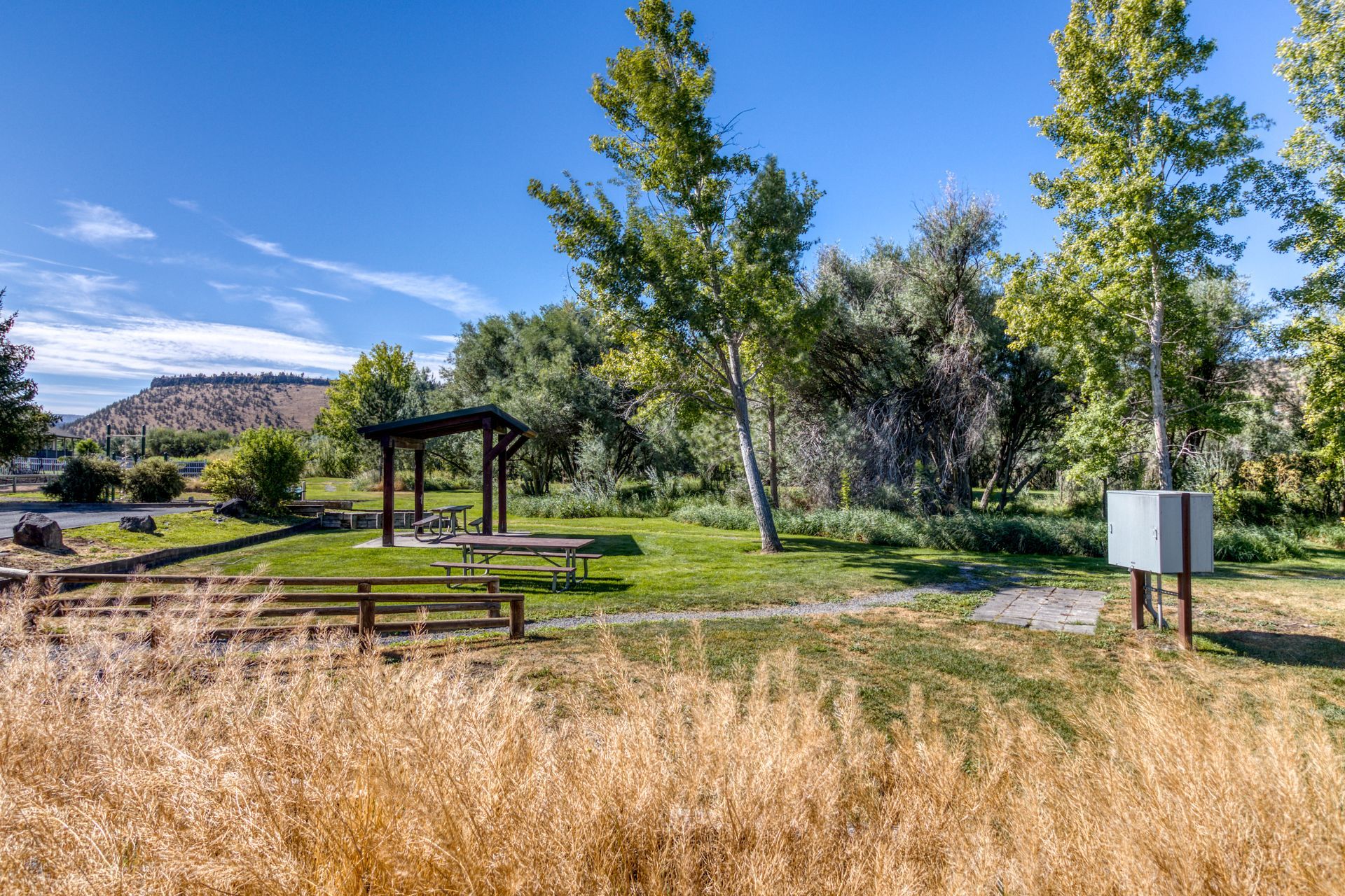 There is a picnic table in the middle of the park.