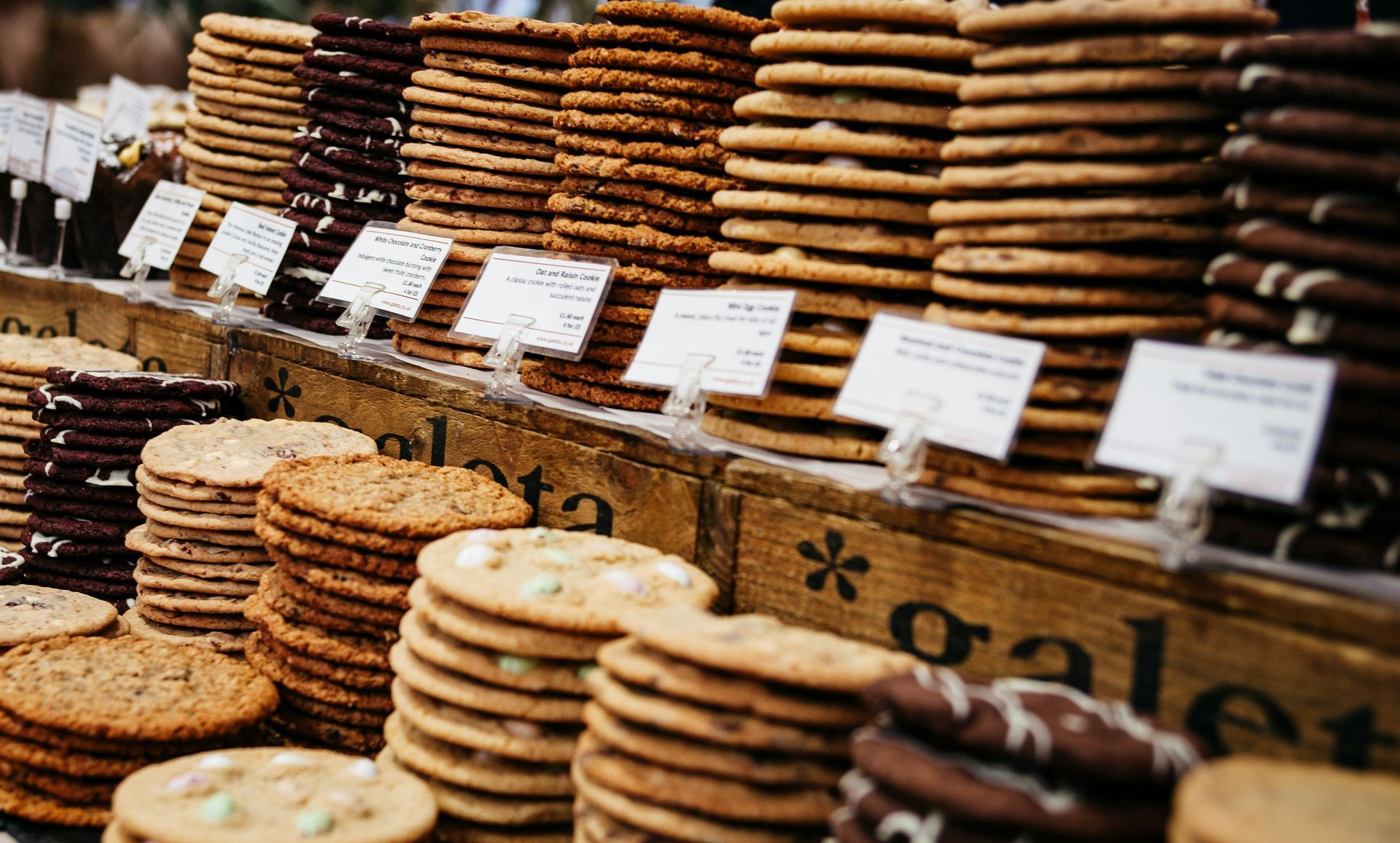 Many different types of cookies are stacked on top of each other