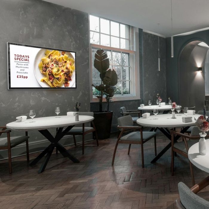 A restaurant with tables and chairs and a sign that says today 's special