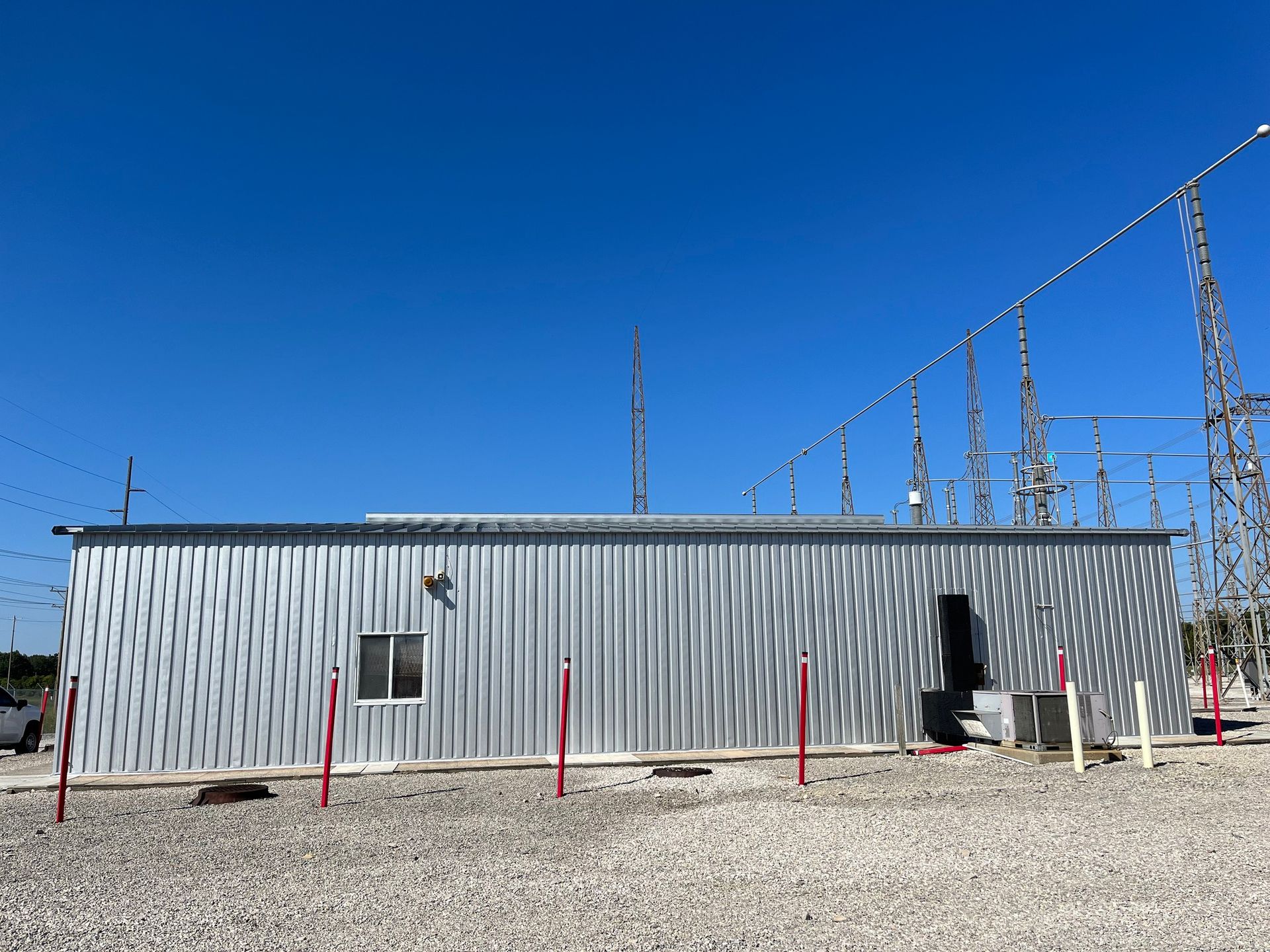 A metal building with a blue sky in the background