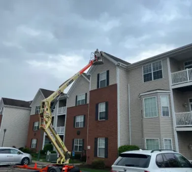 Siding installation for Condo complex using man lift