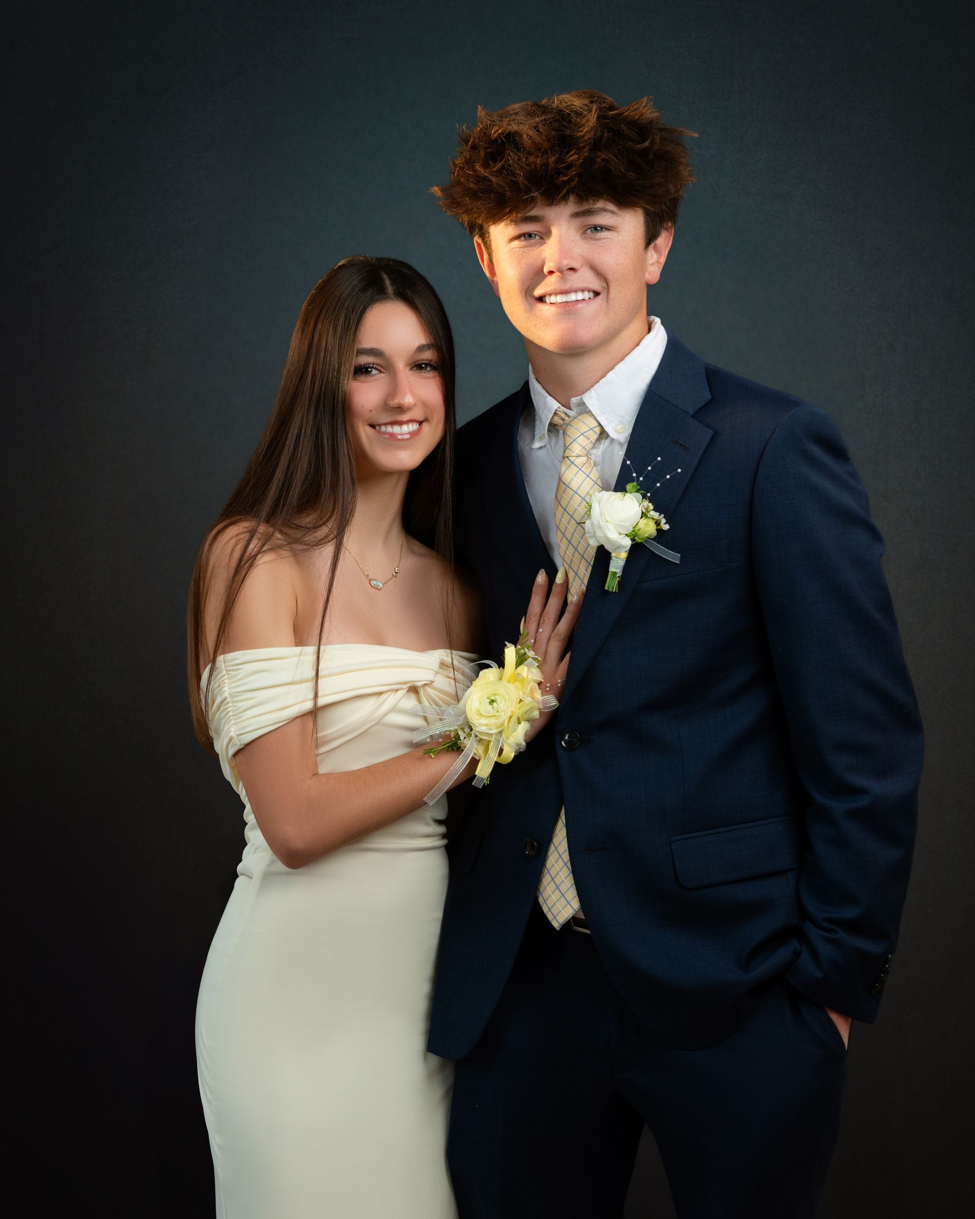A group of high school students posing during the school Winter Formal event.