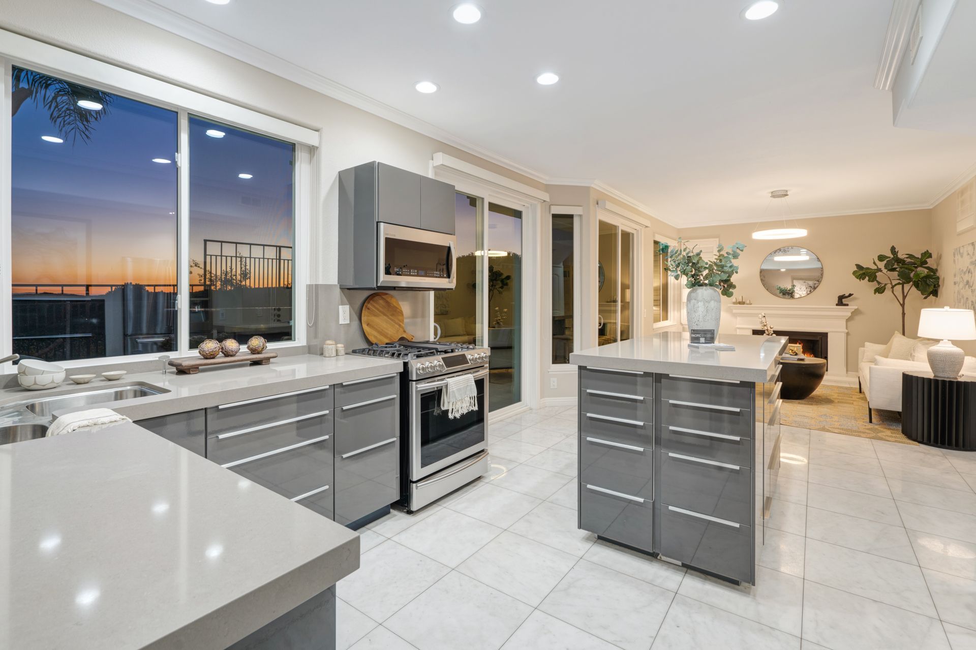Bright modern luxury kitchen interior with island and open living space