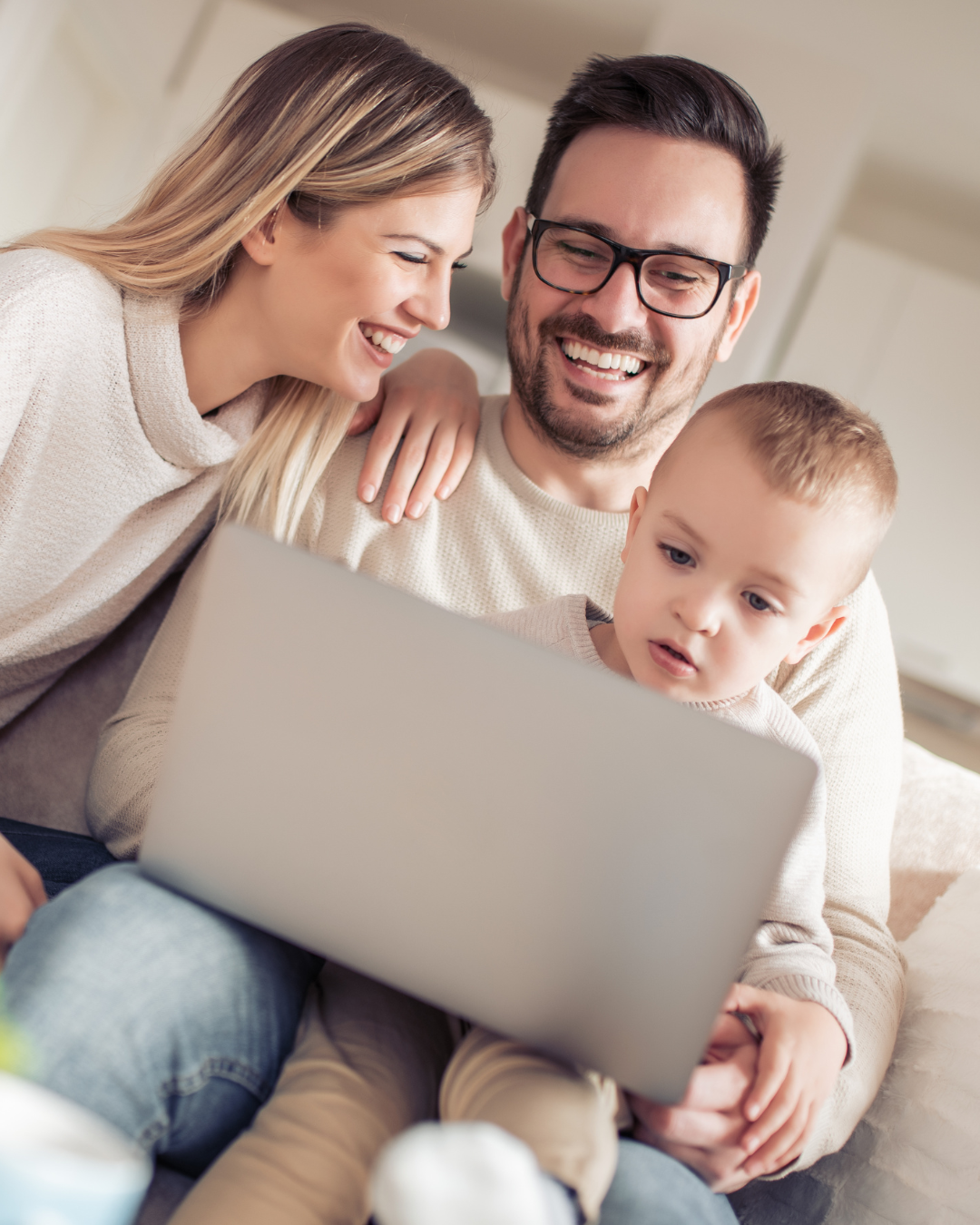 Family at home using a laptop together