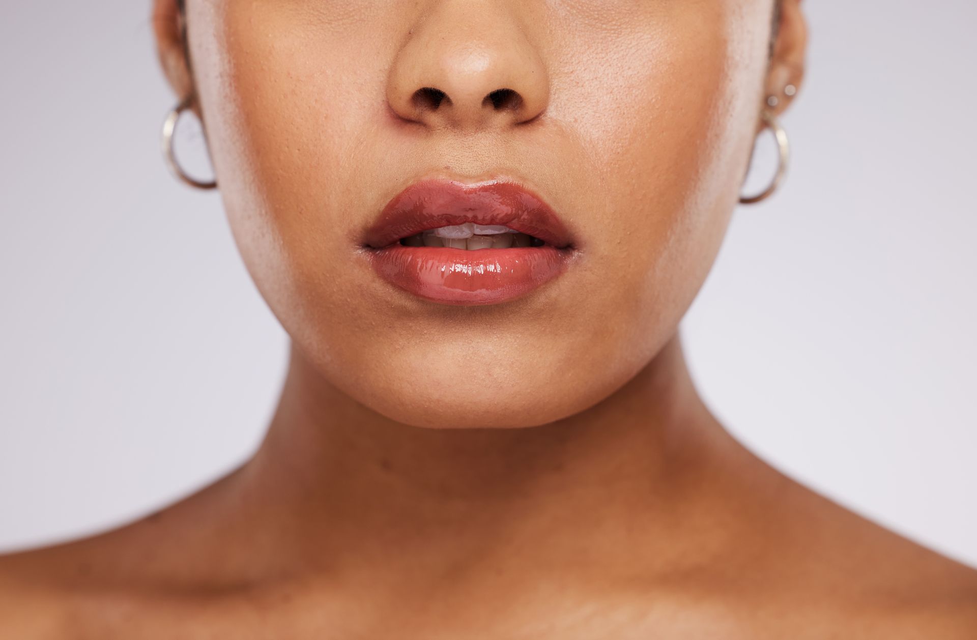 a close up of a woman 's face with her mouth open
