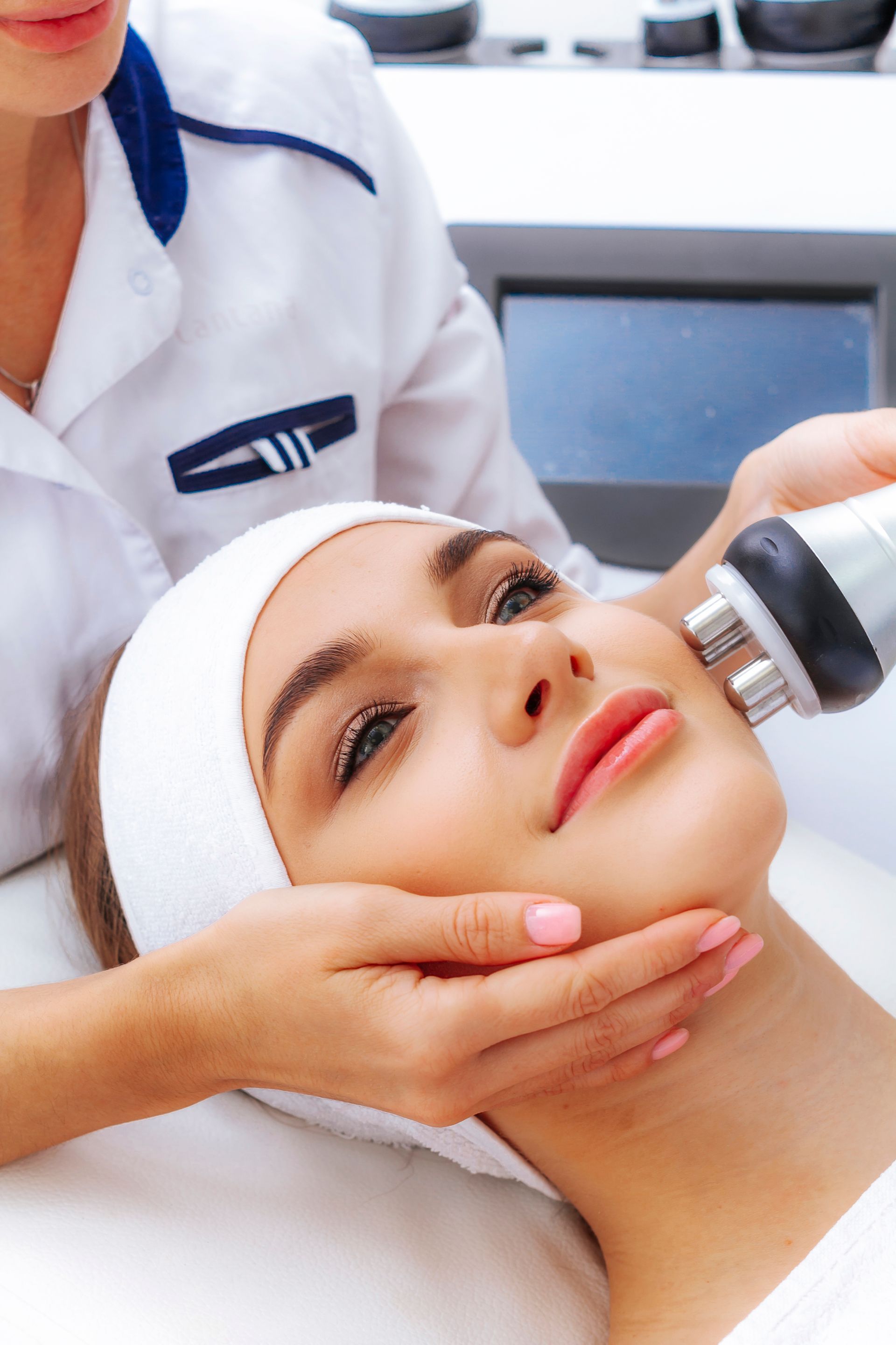 a woman is getting a facial treatment at a beauty salon