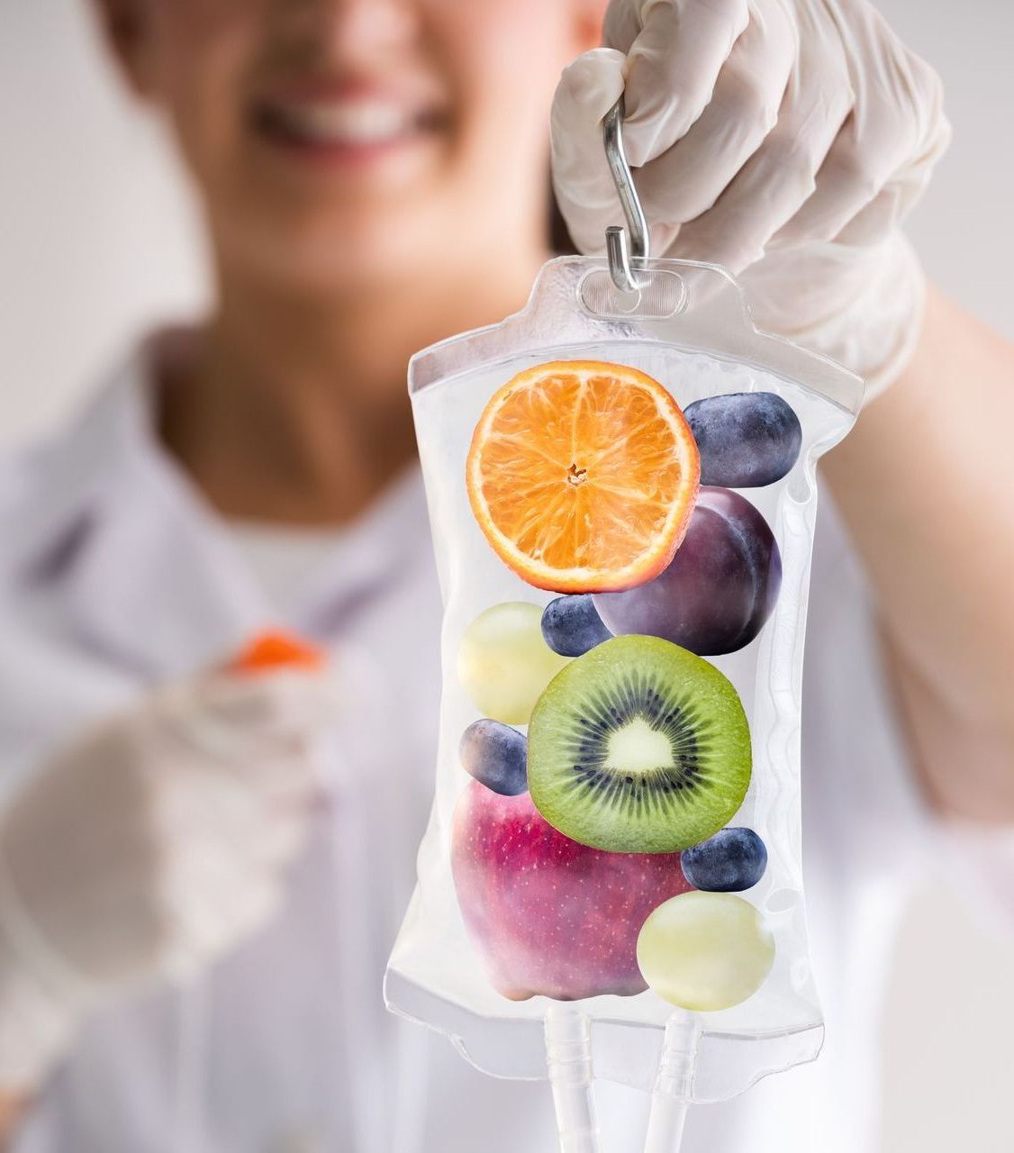 a woman is holding a bag of fruit in her hand