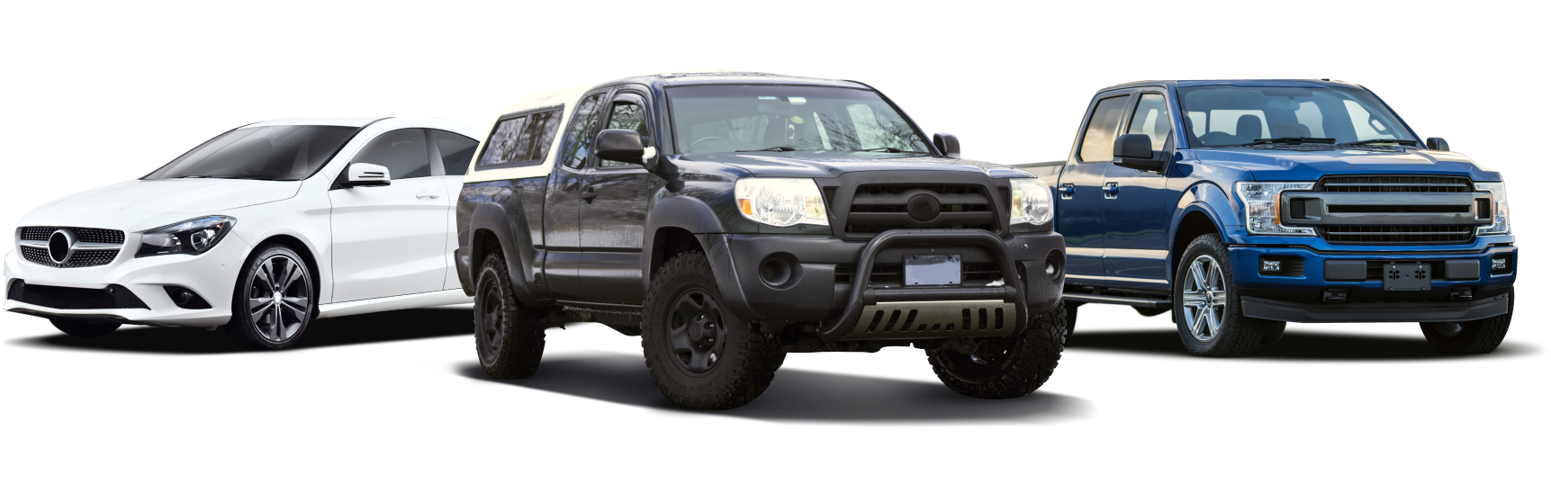Three vehicles: white sedan, black pickup truck, and blue pickup truck.