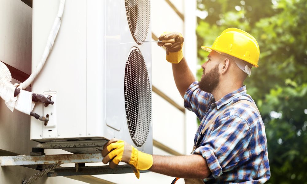 professional hvac technician measuring amperage on