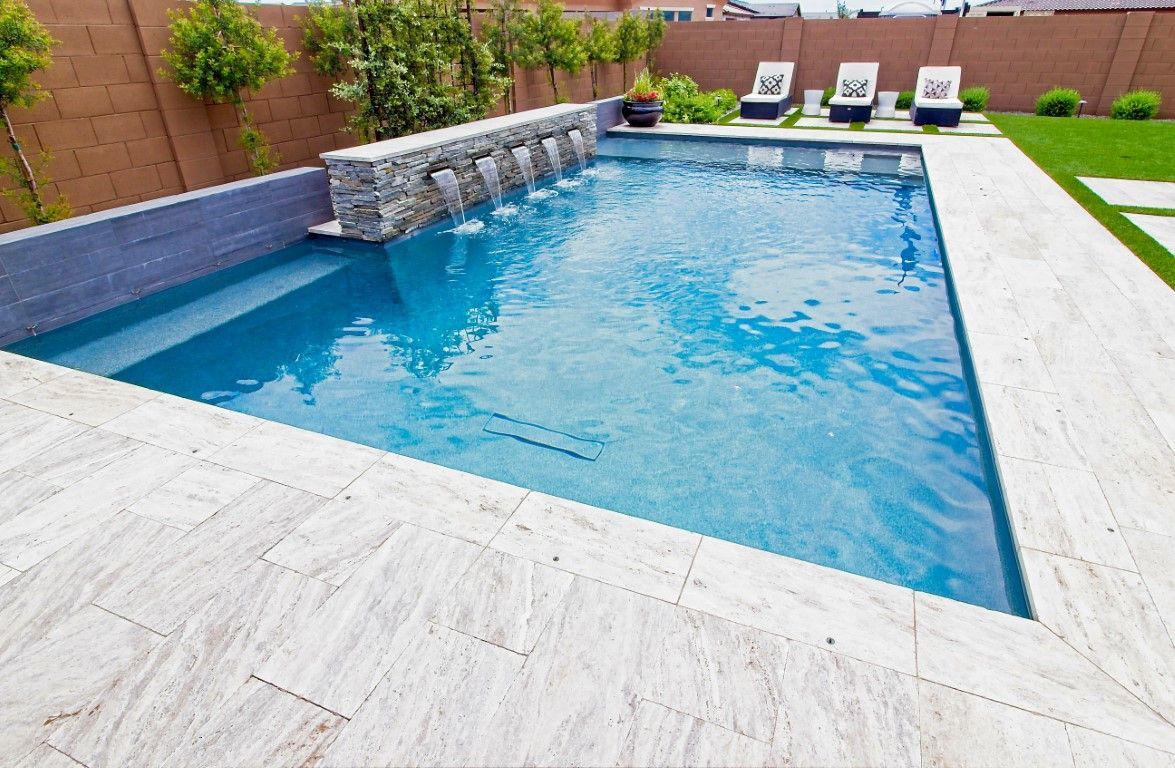 Swimming pool with side waterfall