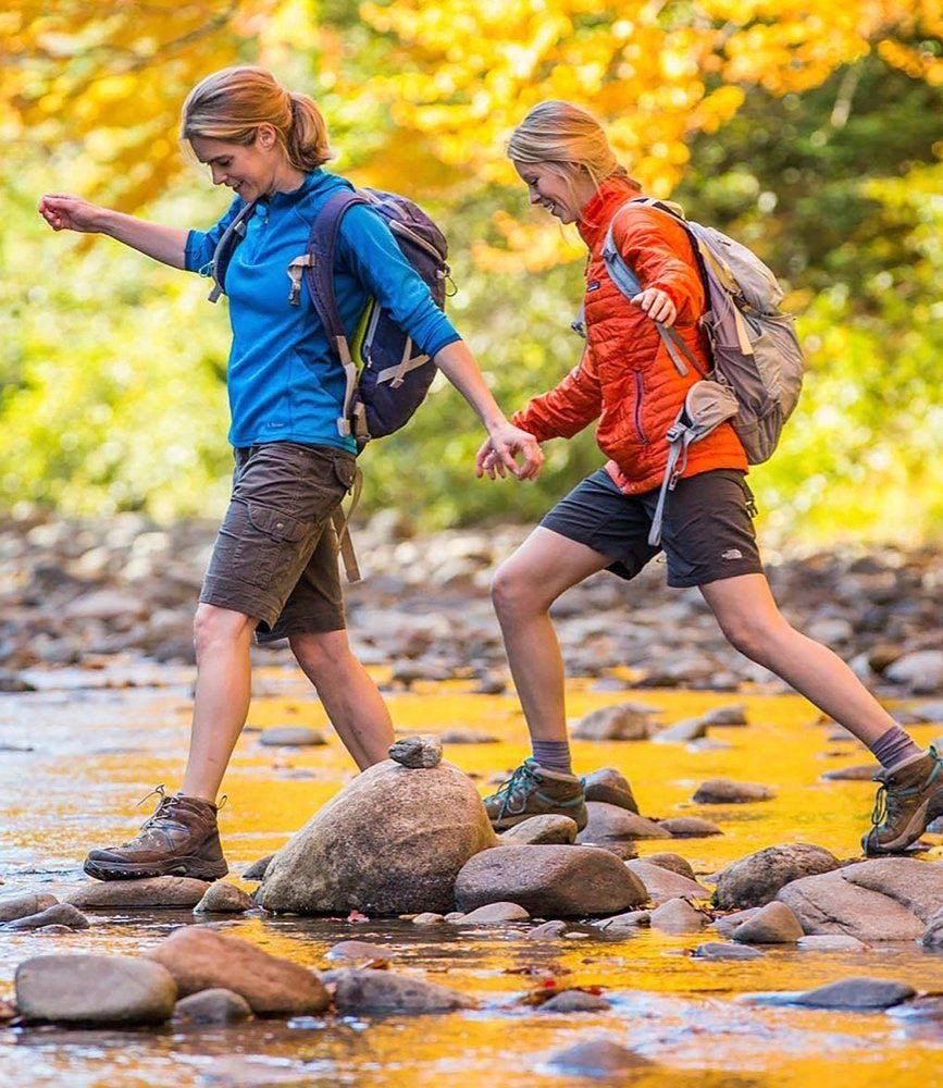 2 people crossing a river