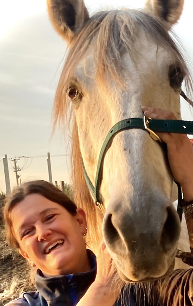 Equine massage therapist, Sarah Wood, with a happy horse after a treatment in Lincolnshire