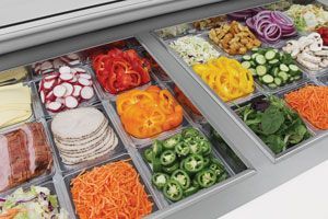 A refrigerator filled with a variety of vegetables and meats.