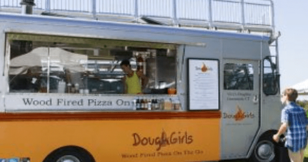 A food truck that says dough girls on it