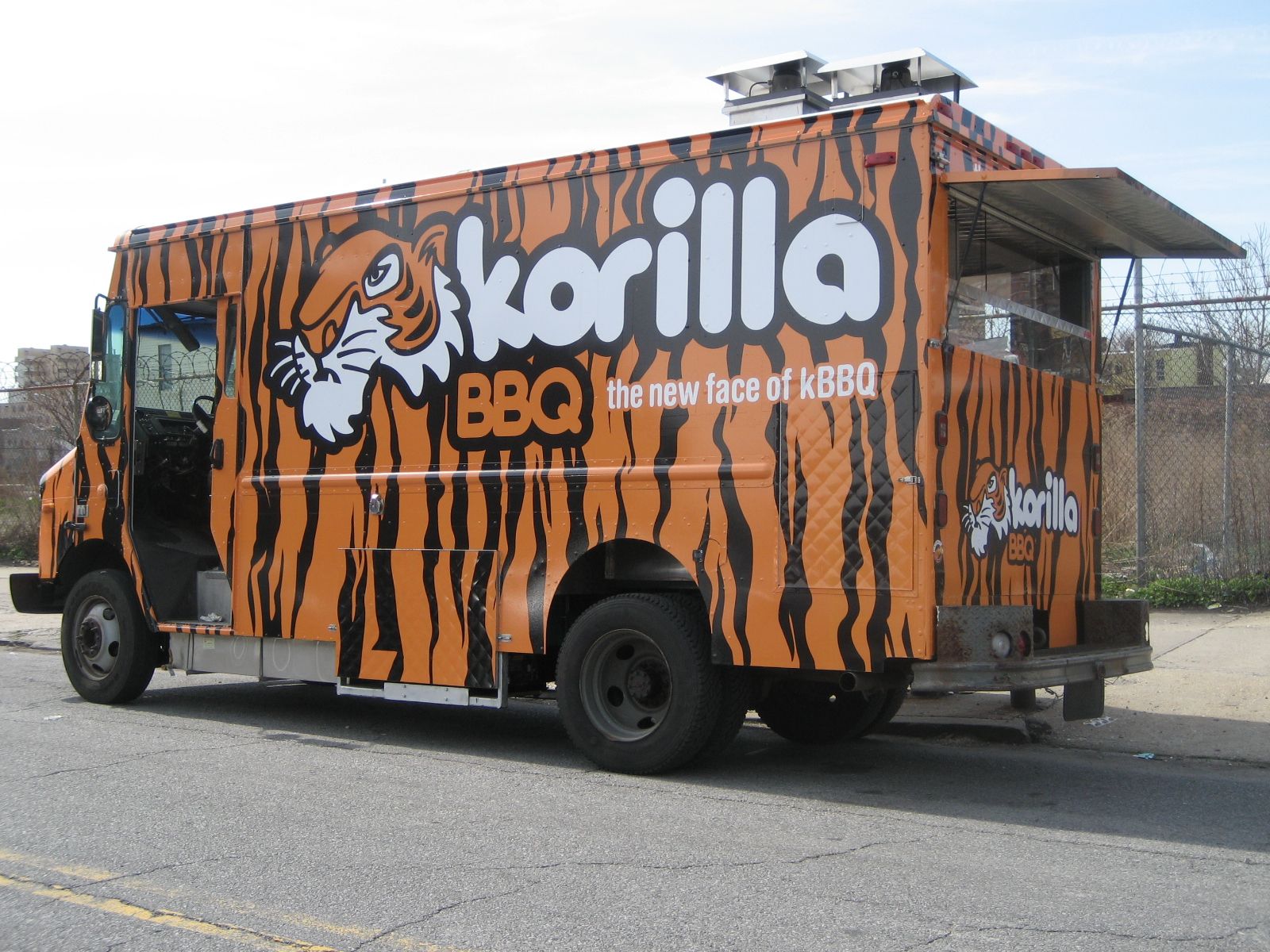 A korilla bbq truck is parked on the side of the road
