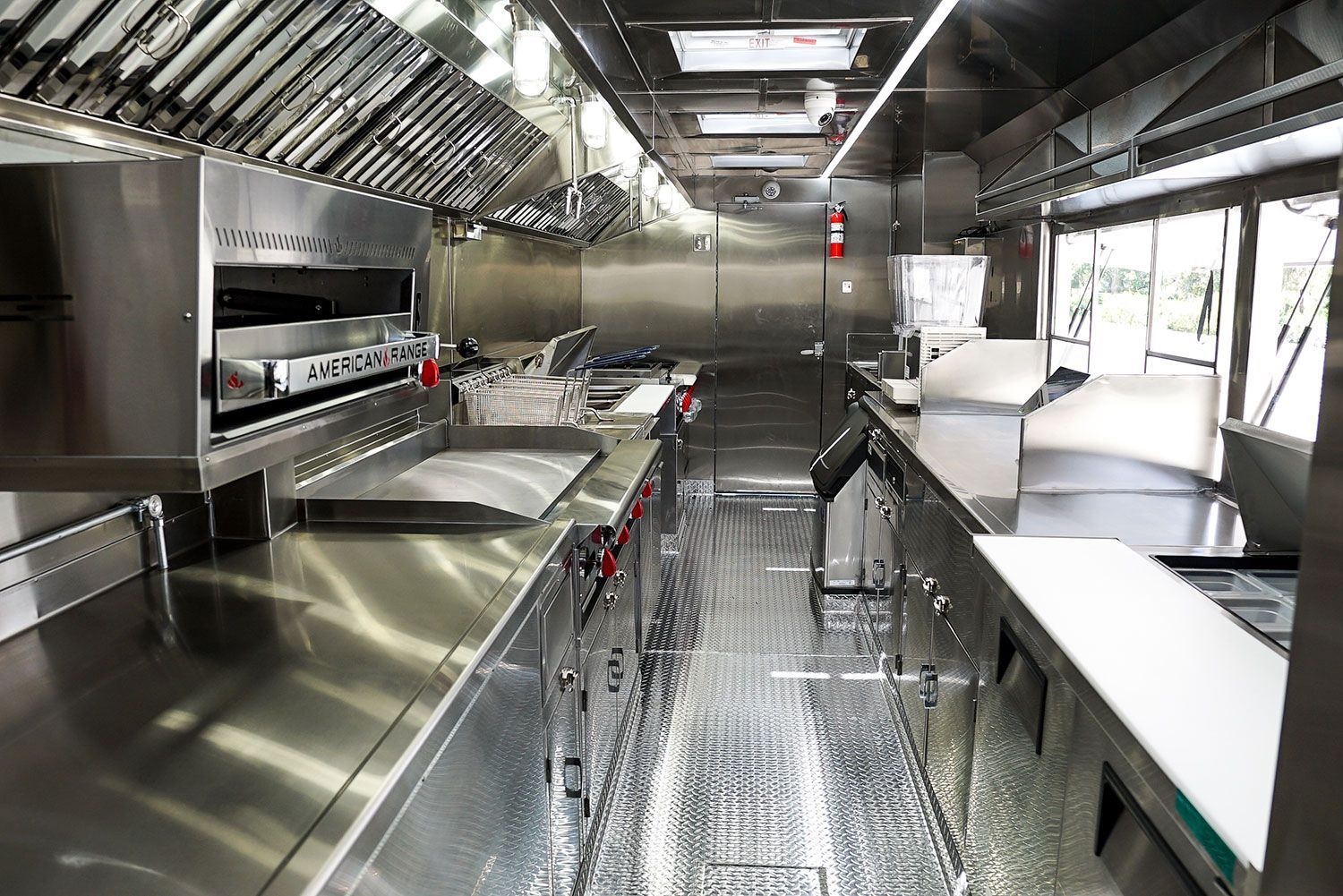 A kitchen with a lot of stainless steel appliances