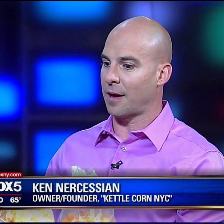 A bald man in a pink shirt is on fox 5