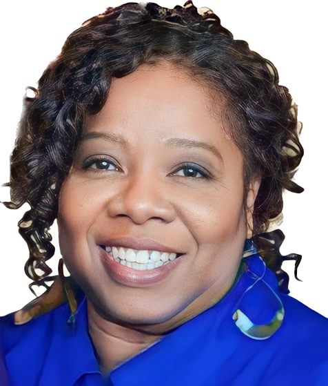 Smiling woman with curly hair wearing a blue top and large hoop earrings on a white background