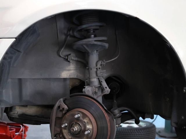 Front suspension strut and brake disc on a car in Nuneaton