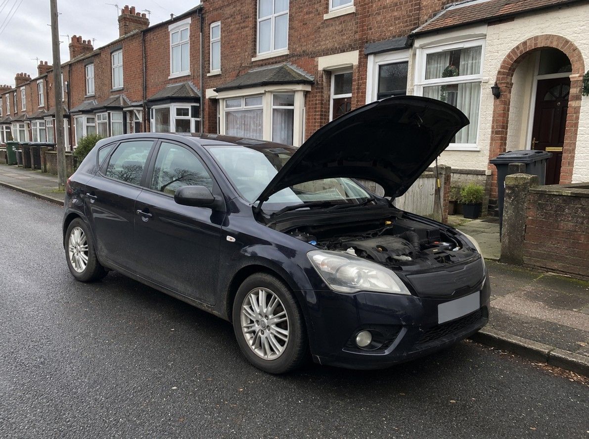 Emergency mobile mechanic Coventry attending a broken down car on a residential street
