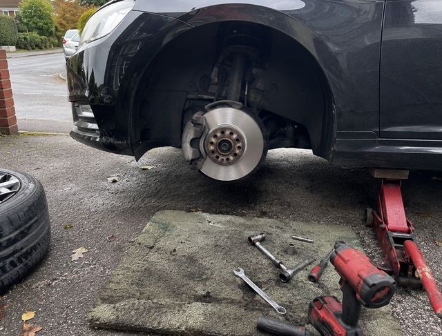 Brake disc exposed during a roadside brake repair in Coventry