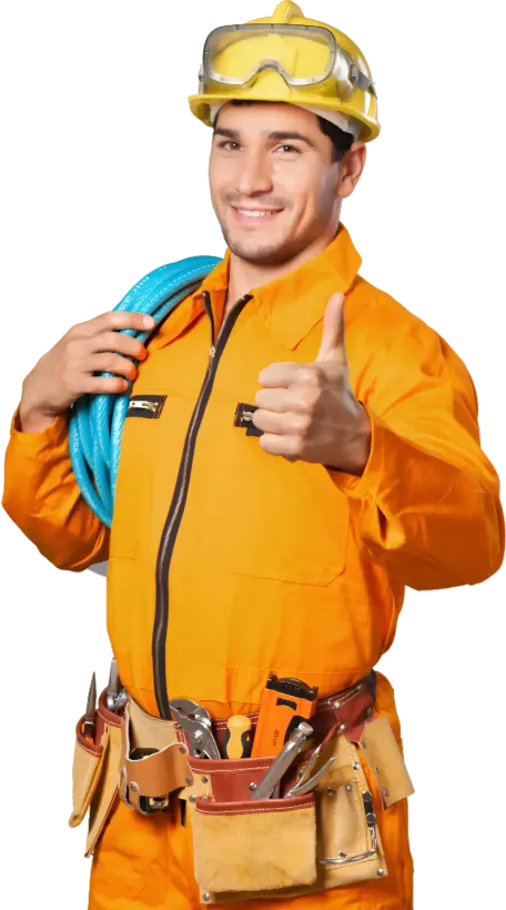 A man wearing a hard hat and goggles is giving a thumbs up.