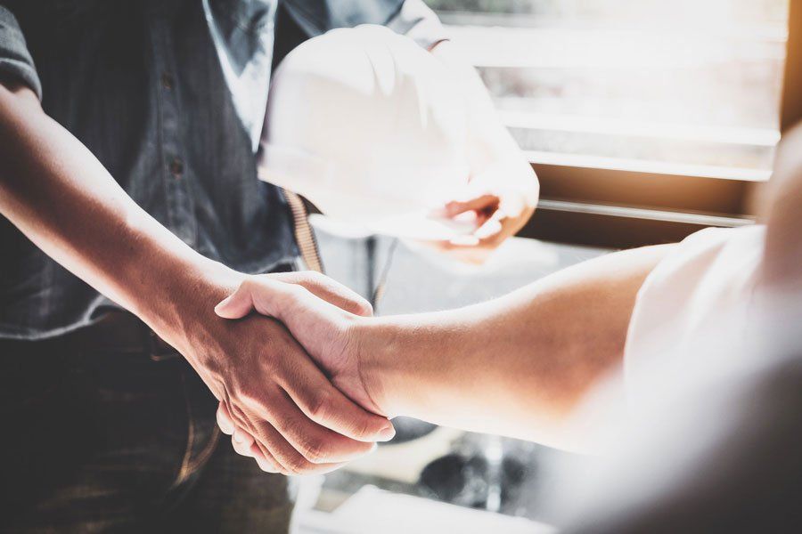 Workers Shaking Hands — Miami, FL — American Quality Assurance Group