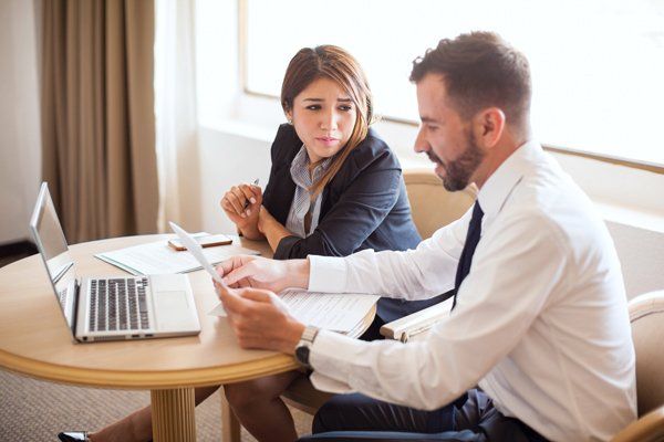 Insurance Agent Explaining Excess Liability — Miami, FL — American Quality Assurance Group Insurance Agent Explaining Excess Liability — Miami, FL — American Quality Assurance Group