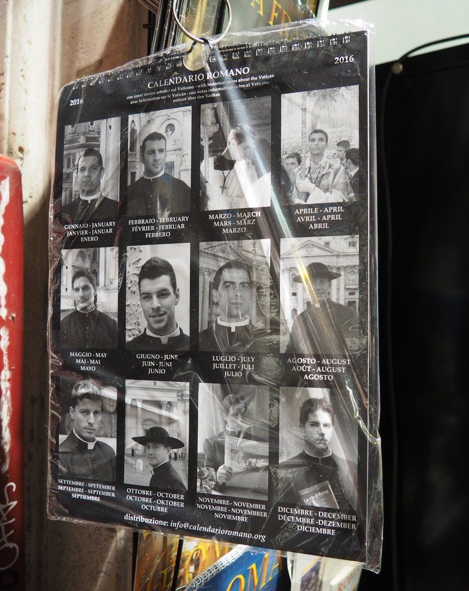 Memorial poster with multiple black-and-white portrait photos and names, wrapped in clear plastic outdoors