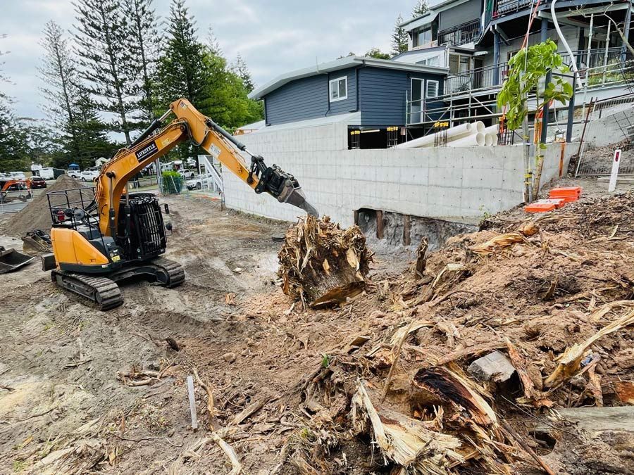 A Large Building Is Being Demolished by A Bulldozer — Lifestyle Demolition In Byron Bay, NSW