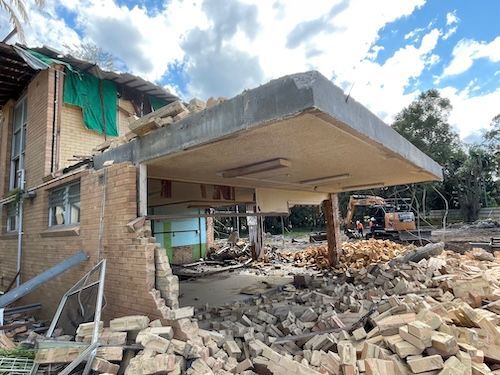 A Large Building Is Being Demolished by A Bulldozer — Lifestyle Demolition in Kingscliff, NSW