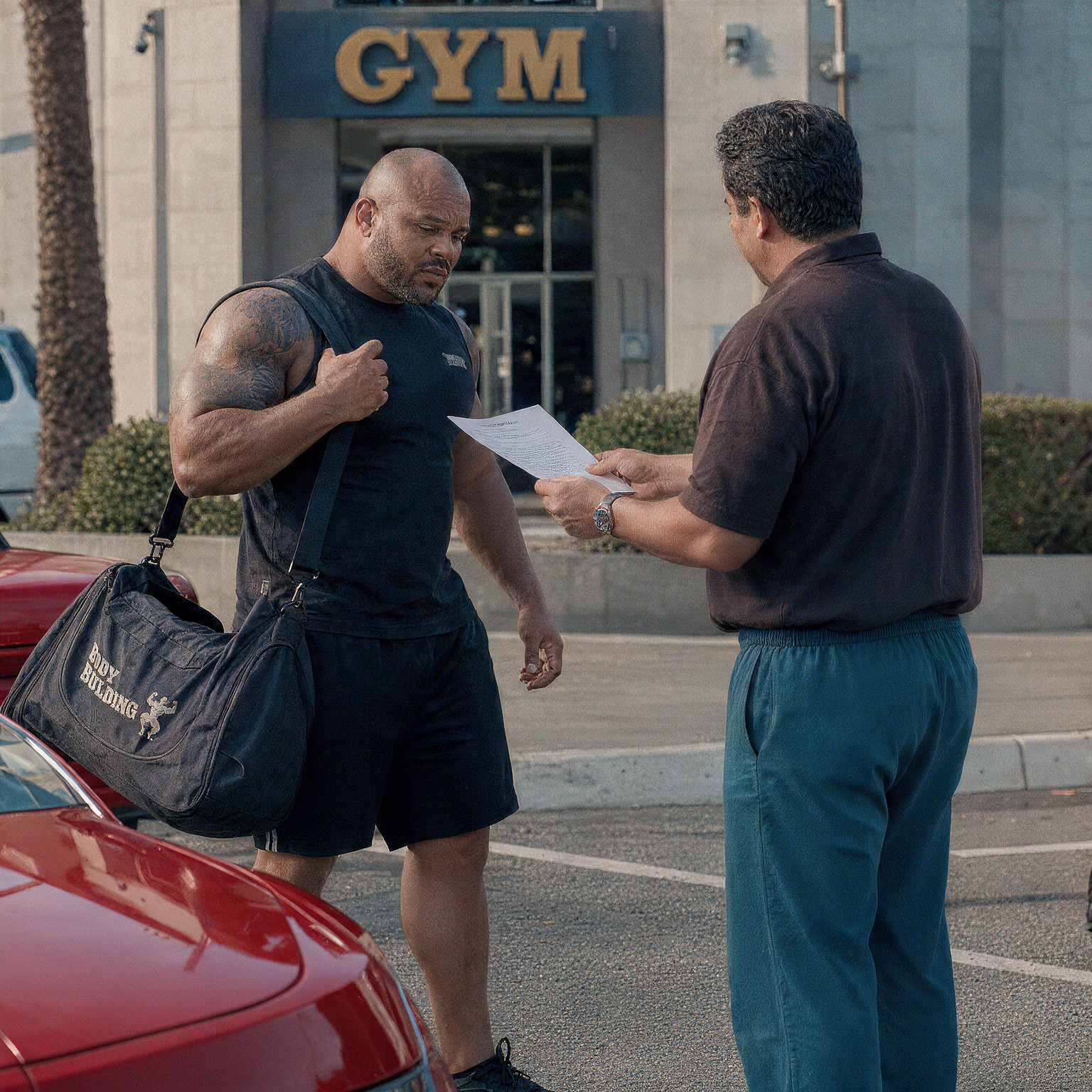 Process server serving court documents to the respondent at the gym's parking space in Camano Island