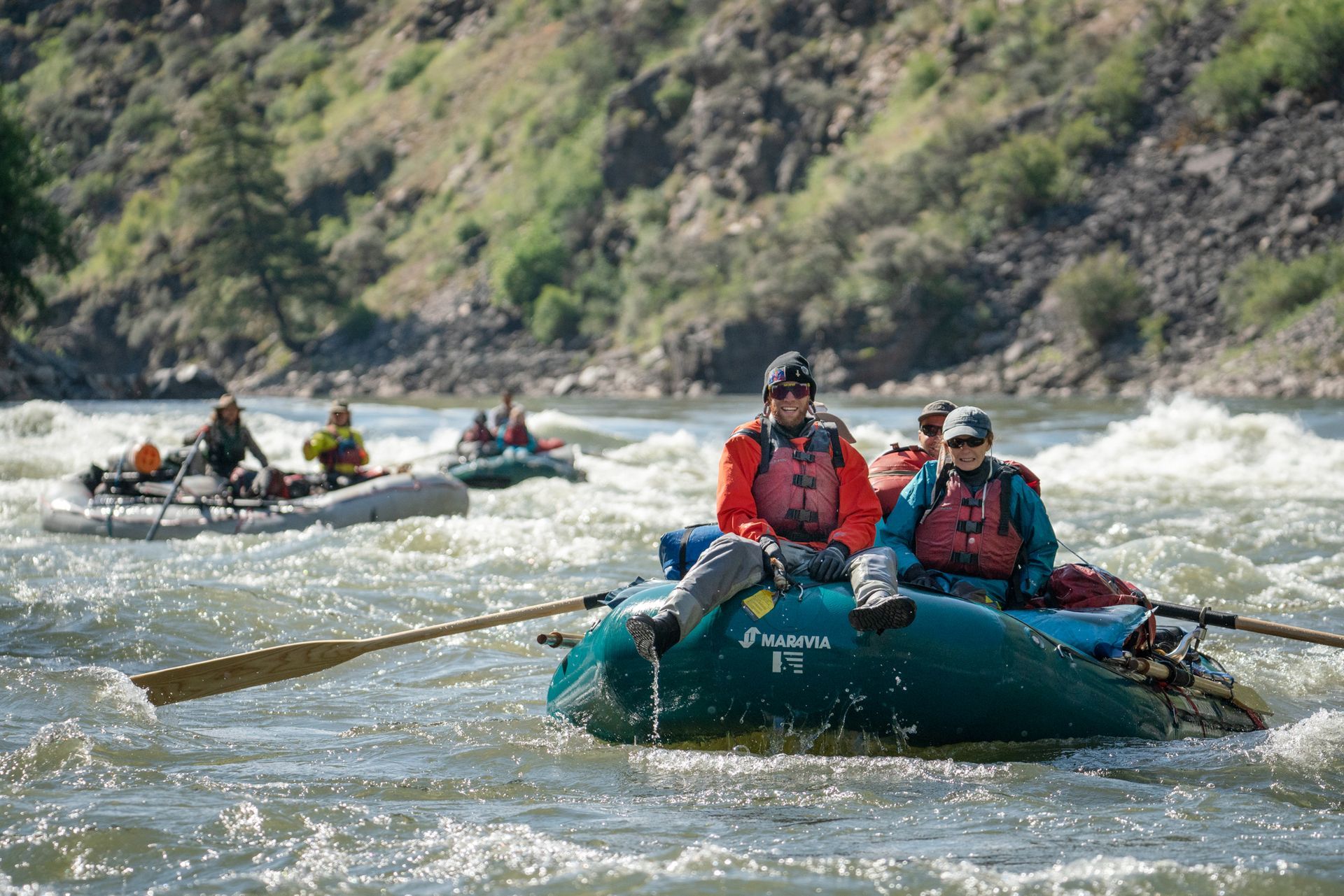 A group of people are rafting down a river.