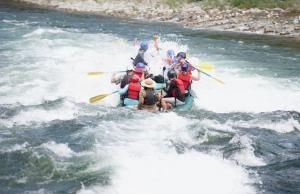 A group of people are rafting down a river.