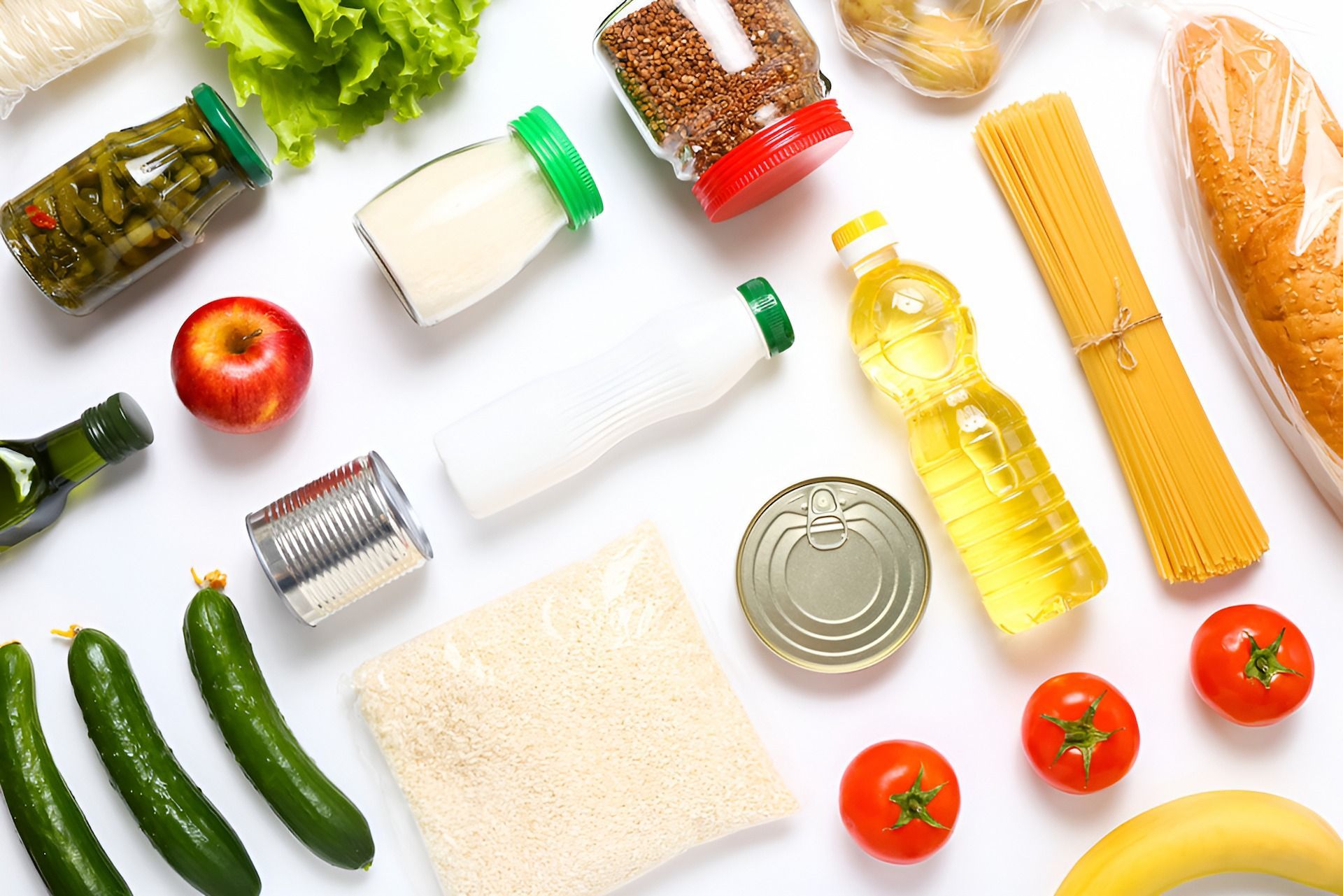 A Variety of Food Items Are Laid Out on a White Surface — Corrado & Frank Distributors in Southern Highlands, NSW
