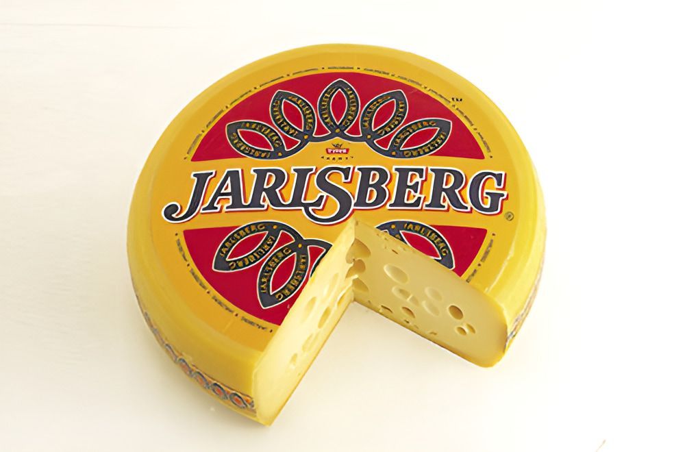 A Piece of Cheese With the Word Jarisberg on It — Corrado & Frank Distributors in Fairy Meadow, NSW