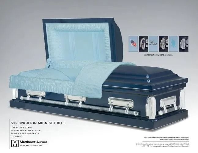 Navy blue casket with light blue interior, open.