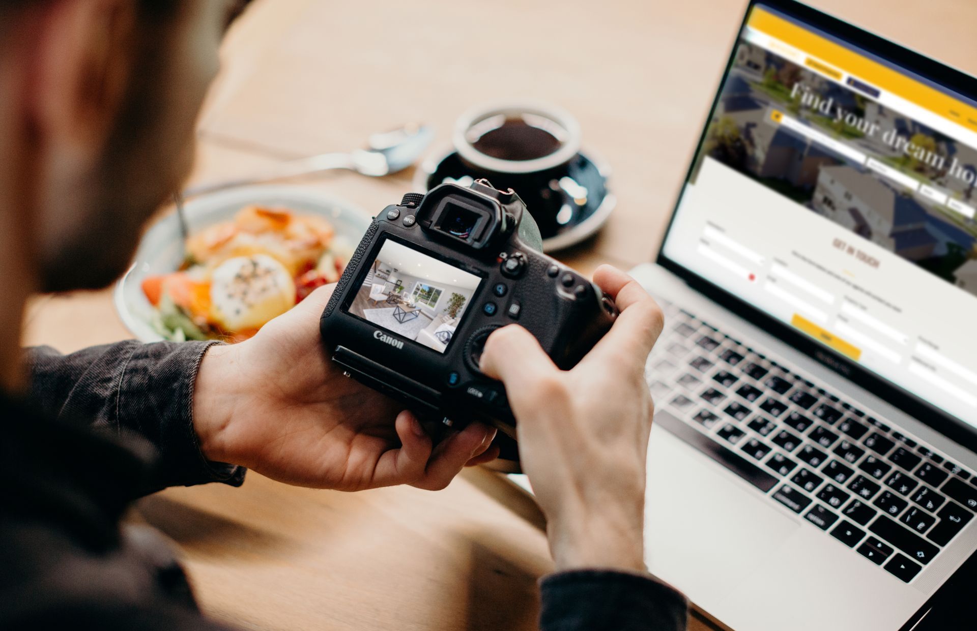 Web Developer making a website for Real Estate looking at a photo of a living room.