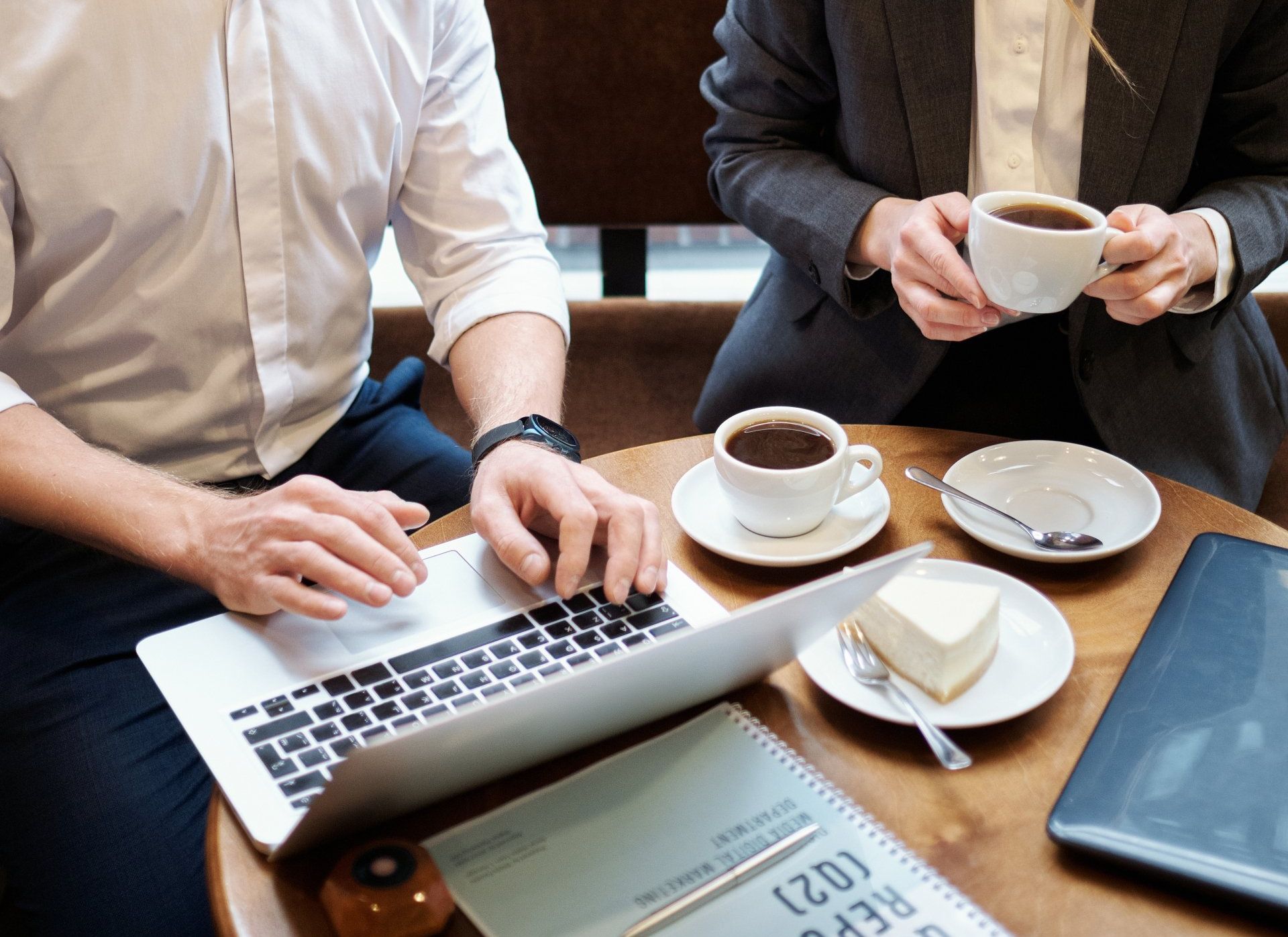 Man and woman having a business meeting over coffee