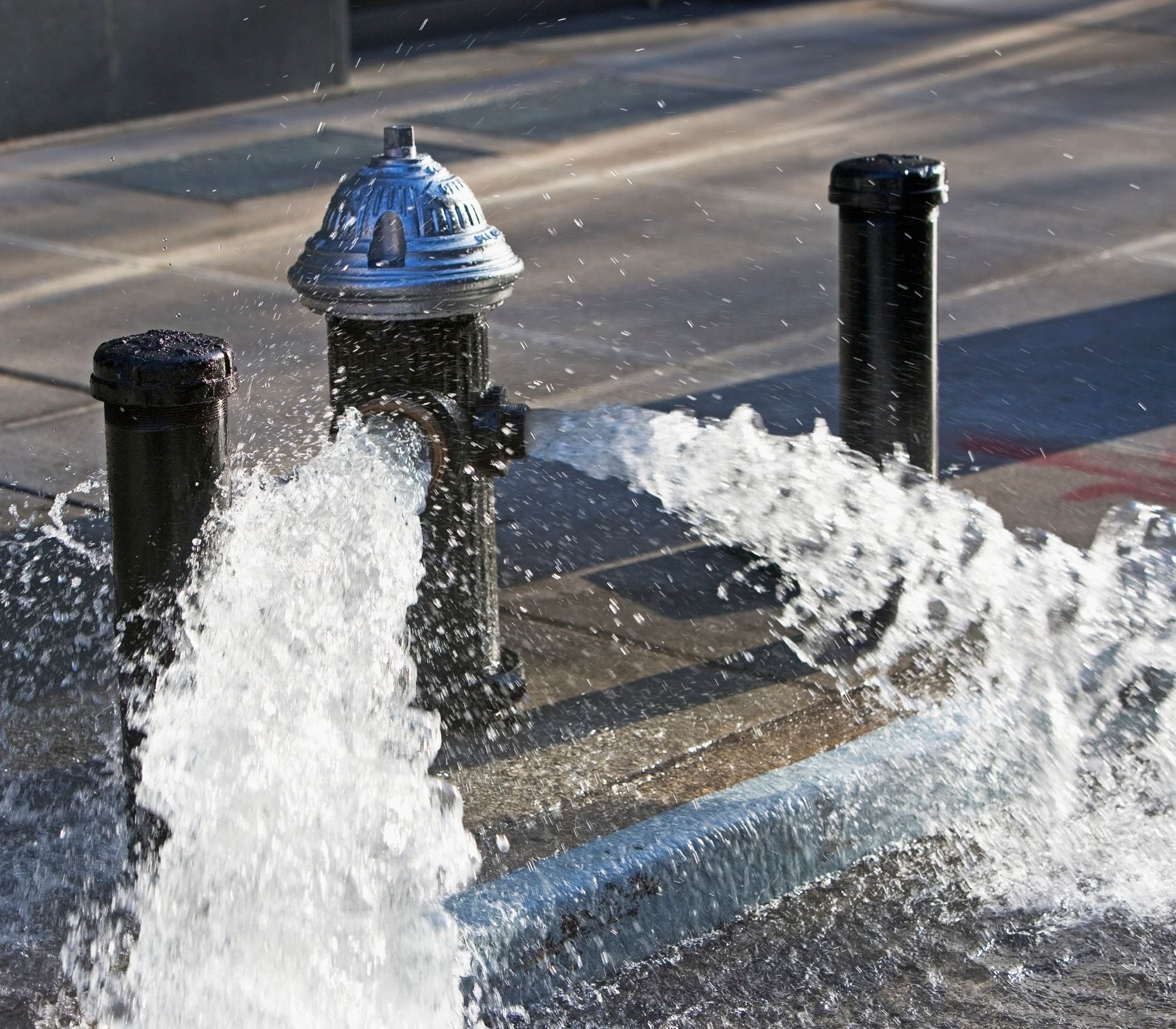 Fire hydrant poring out water – Depiction of fire hydrant flow test. Fire hydrant poring out water – Depiction of fire hydrant flow test.