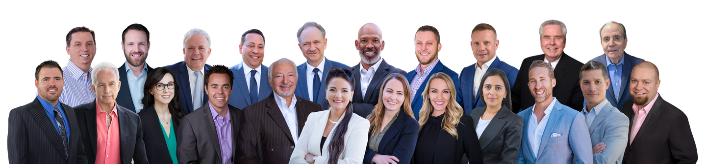 Group of professionals in business attire posing together against a white background