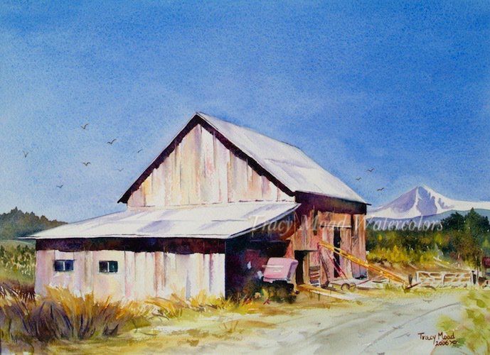 Watercolor painting of a weathered barn under a blue sky, with a mountain in the background.