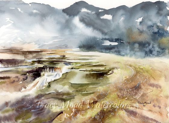 Watercolor landscape of a misty mountain range overlooking a valley. Soft blues, browns, greens dominate.